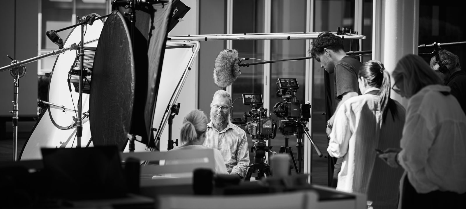 Crew on set, exterior interview setup